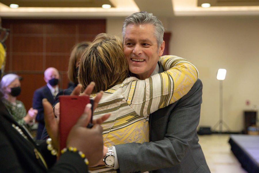 Rick Muma hugs Teri Hall, vice president of student affairs, after being named the 15th  president of Wichita State University Thursday, May 6.