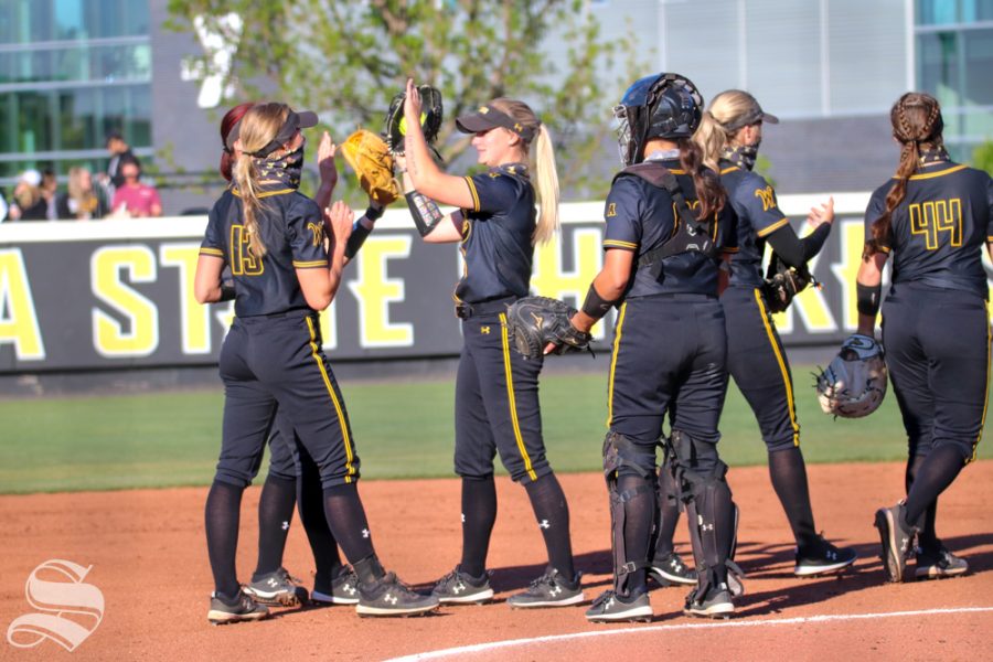 Wichita+State+softball+players+have+a+little+pep+talk+equipped+with+high+fives+all+around+during+a+game+against+University+of+Oklahoma+at+Wilkins+Stadium+on+April+4