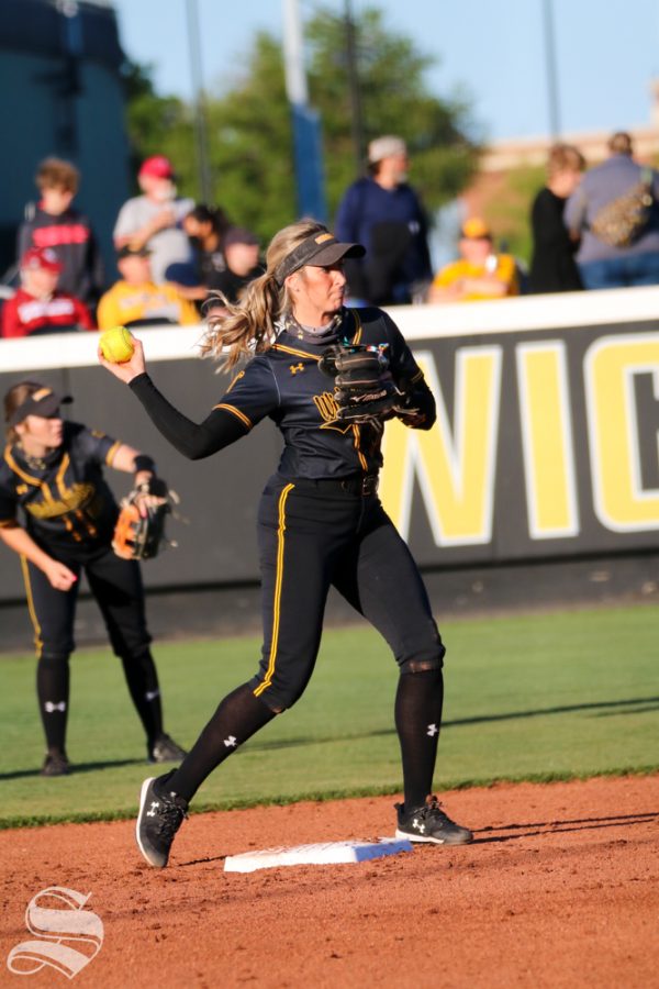 Wichita State, senior Kaylee Huecker throws the ball to her fellow teammate during a game against University of Oklahoma at Wilkins Stadium on April 4