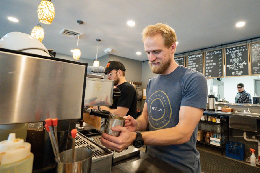 Lucas Lash makes coffee at Fairmount Coffee Company on Aug. 17.