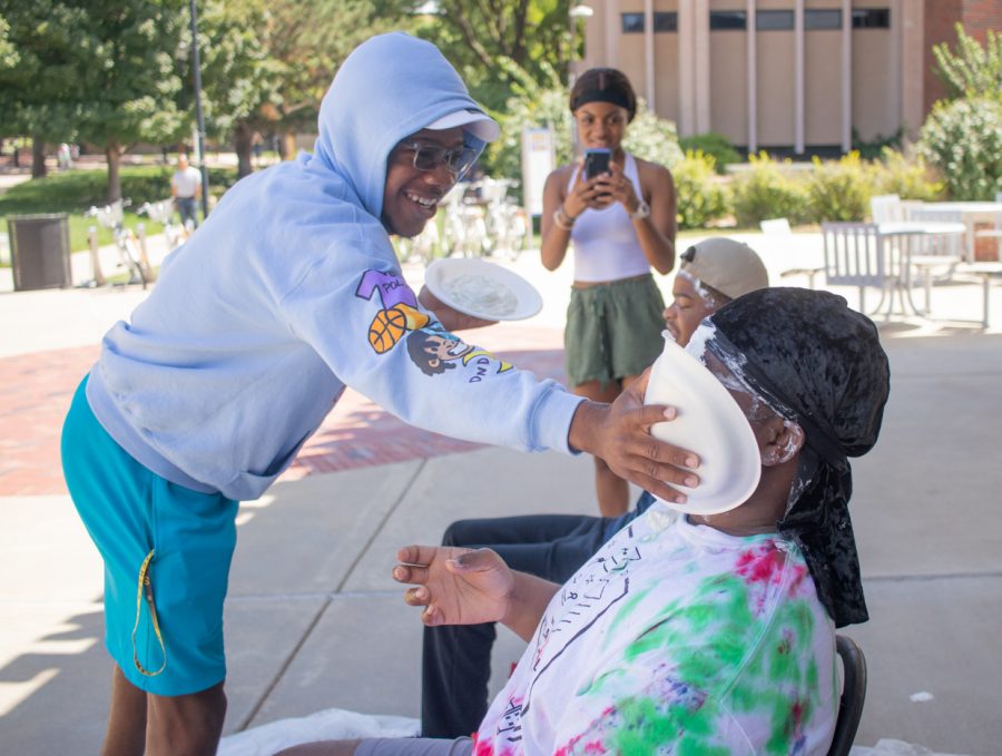 Wichita State students pies two of the Black Student Union during their Pie a cabinet member event on Aug. 23.
