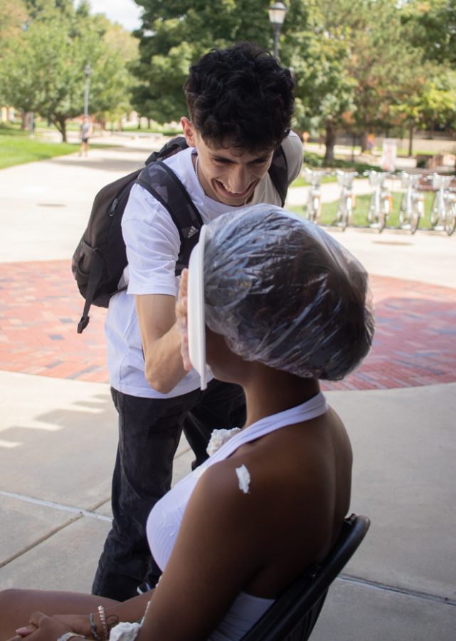 Bashar Alajmi Industral enginerring shophomore gets in on the fun by smacking Kynnedy Moore a cabinet member for the Black Student Union during their Pie a Cabinet Member event on Aug. 23.