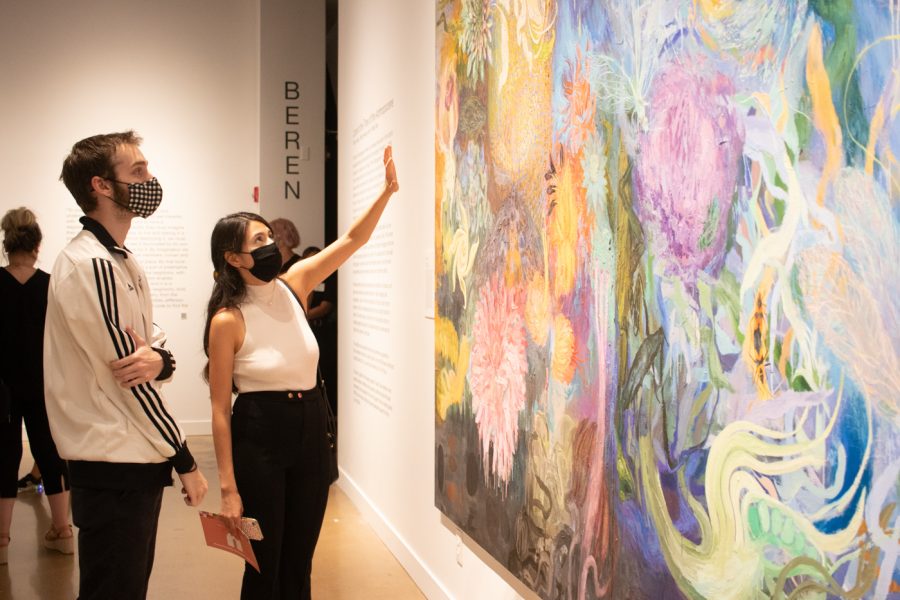 Guests view the complex mural of A. Mary Kay at the Ulrichs fall exhibit opening Aug. 26.