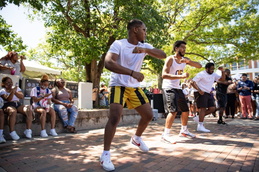 Members of Alpha Phi Alpha fraternity stroll during yard show on Aug 24.