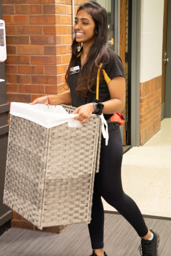 Wichita State student Pavita Paramesuvaran works at the Haskett Center. She is taking the towels to washed.