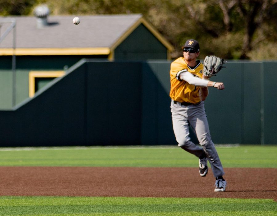 Junior Andrew Stewart throws the ball towards first base during WSU’s game against on Sept. 13 at Eck Stadium.