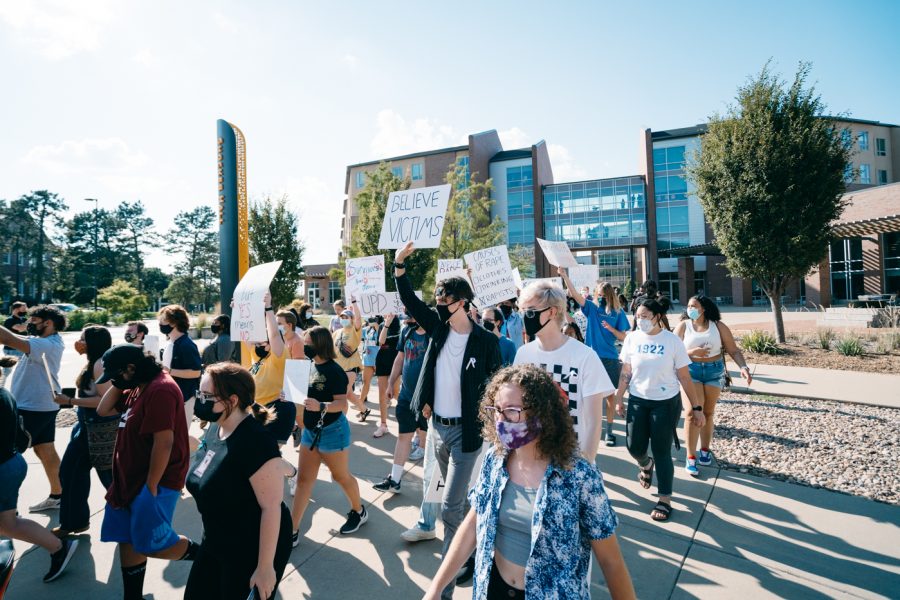 Students marching from Shocker Hall to the University Police department as a part of their protest Friday. The protest was calling for immediate action from the university police department after alleged sexual assault on campus.
