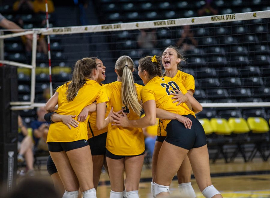 The+Wichita+State+volleyball+team+celebrates+after+scoring+a+point+during+their+match+against+Creighton+on+Sept.+18+inside+Charles+Koch+Arena.