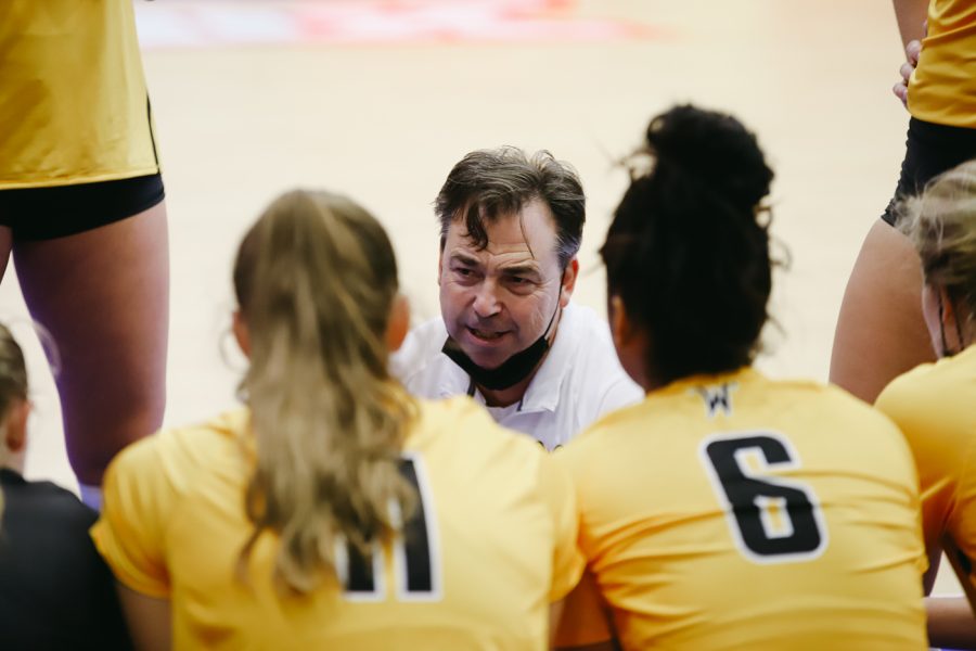 Head coach Chris Lamb talks to the team during the game against Delaware on Sep 11 at Horejsi Family Volleyball Center.