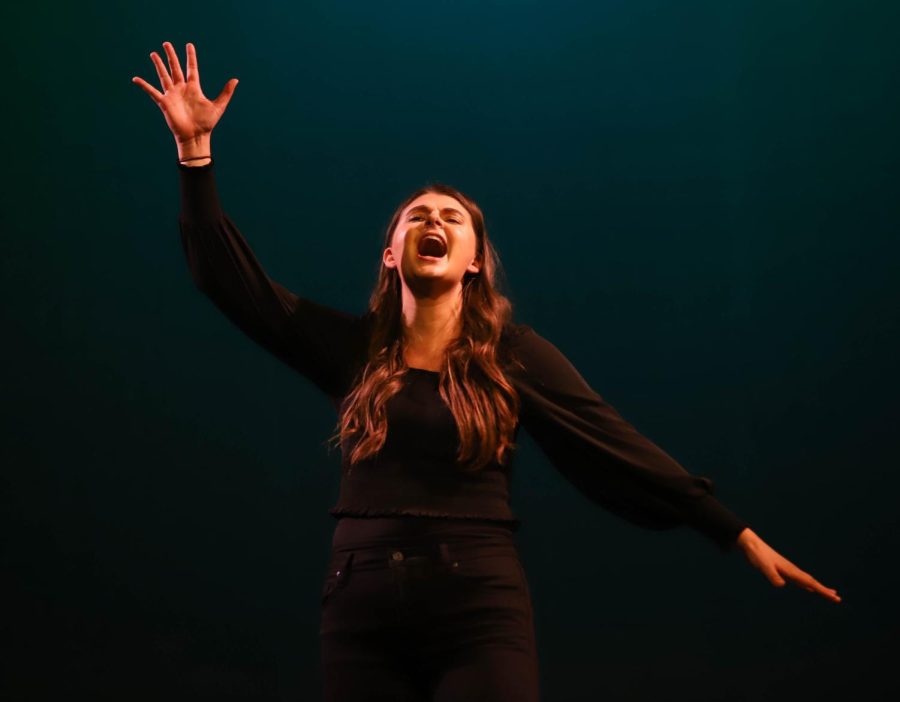 Performing Defying Gravity from Wicked, senior Megan Ahern sings and plays the role of The Wicked Witch of the West, Elphaba.