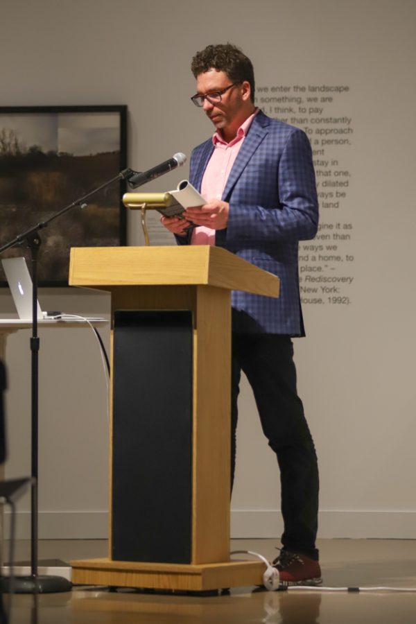 Sam Taylor reads from his previous book, Nude Descending an Empire, on Oct. 19 inside the Ulrich Museum.