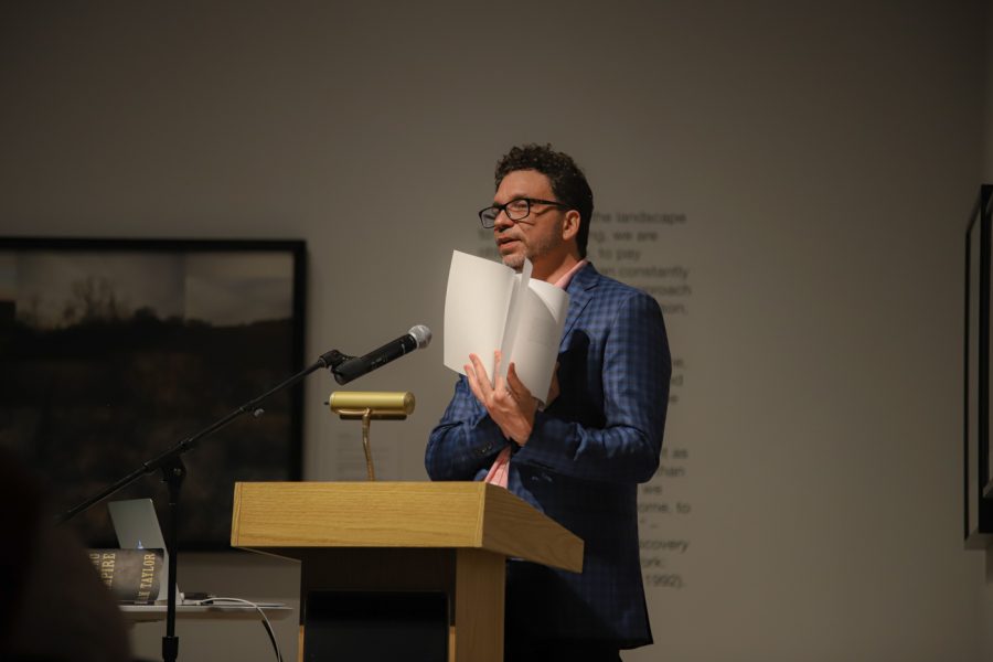 Sam Taylor shows the audience some of the layout in his new book, Book of Fools on Oct. 19 inside the Ulrich Museum.