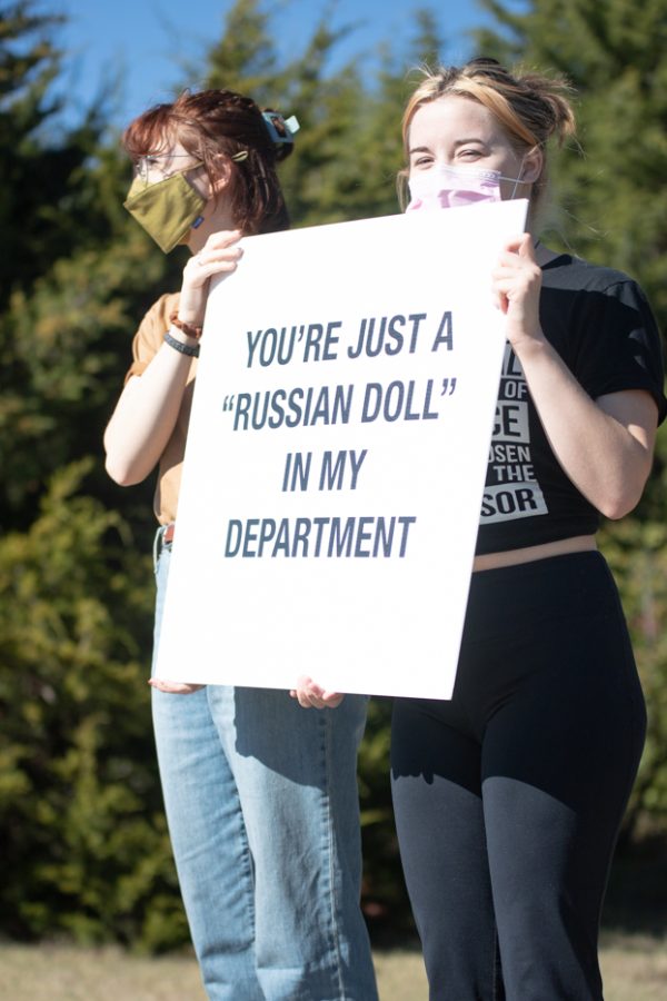 Wichita State University students holds a sign as they protest of the harrassment of Professor Karen Countryman-Roswurm. The students held a sign that said Russian doll to show an example of discriminative language.