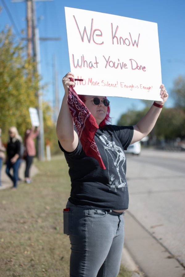 Rexhd Martin holds her sign to support Professor Karen Countryman-Roswurm during the presidental inaguration on Oct. 29 outside of the Metroplex. Countryman-Roswurm filed a federal lawsuit against WSU from harrassment.