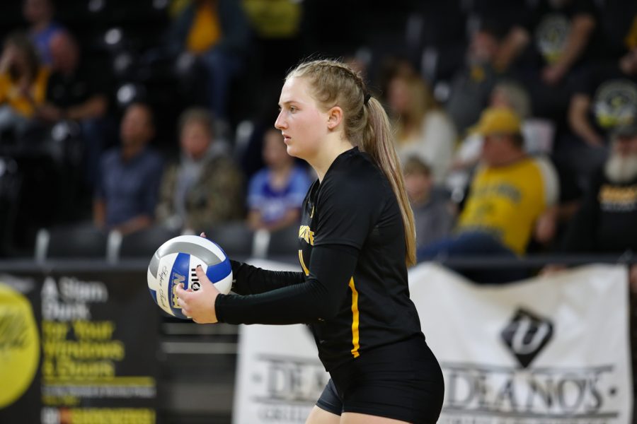 Sophomore Lily Liekweg gets ready to serve the ball during the game against SMU at Charles Koch Arena on Nov. 25.
