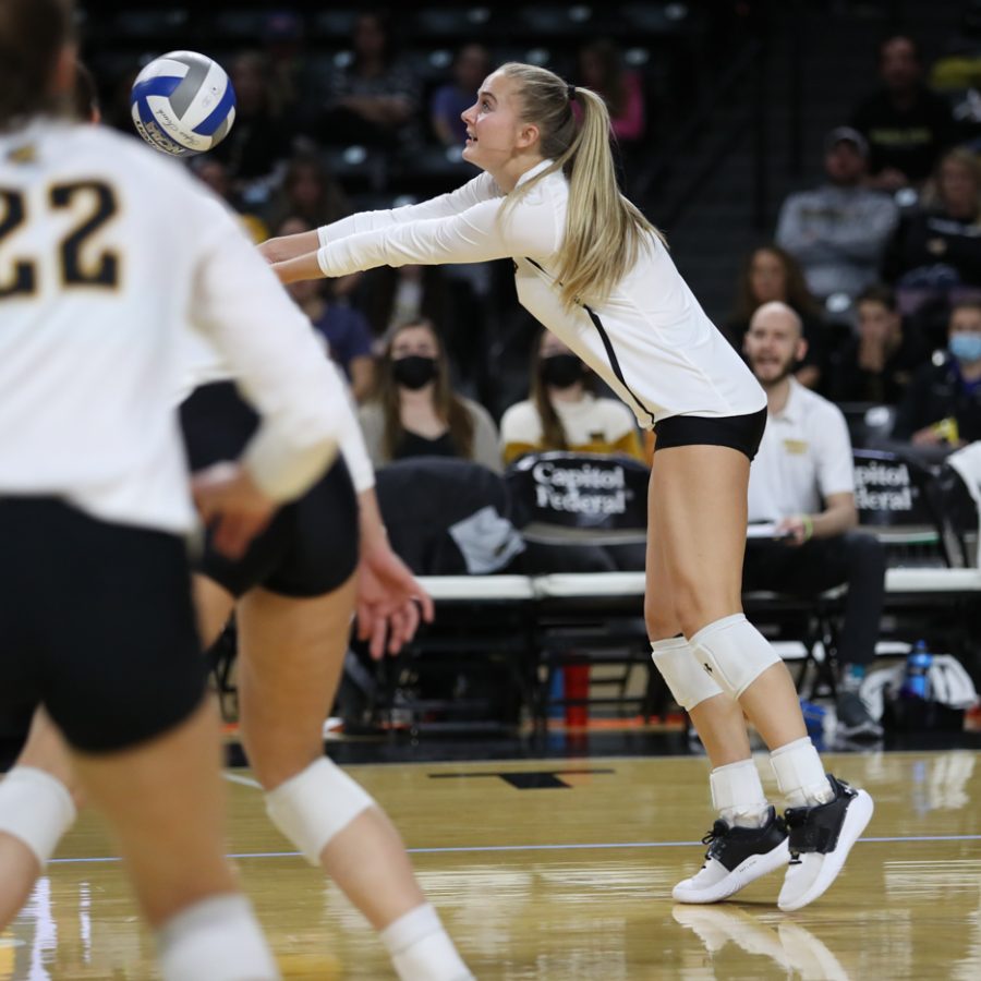 Sophomore Kayce Litzau digs the ball during the game against SMU at Charles Koch Arena on Nov. 25.