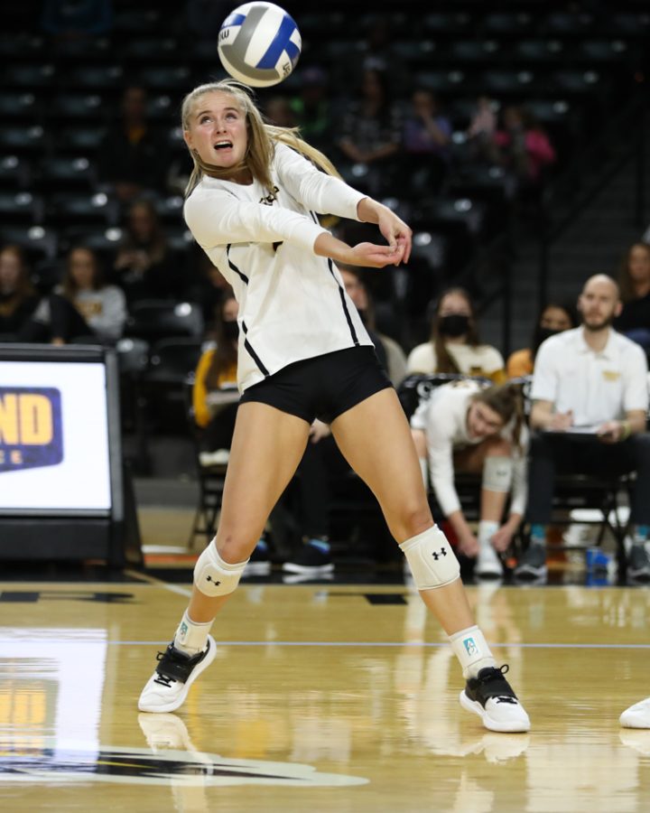 Sophomore Kayce Litzau digs the ball during the game against SMU at Charles Koch Arena on Nov. 25.