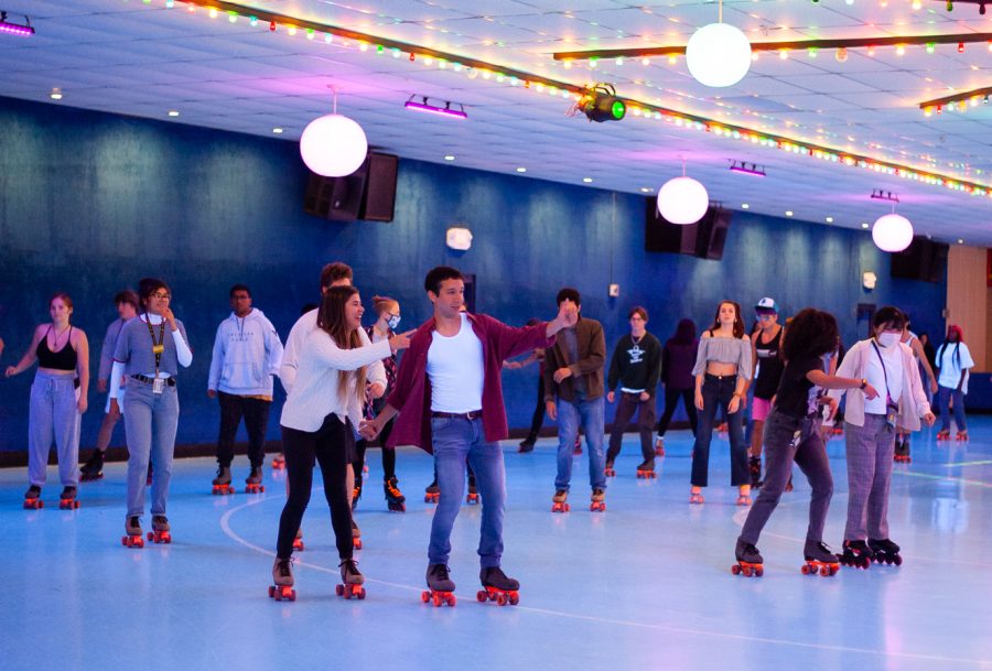 At the 2000s themed skate night on Nov. 6, WSU students skate together around the Carousel Skate Center rink. 
