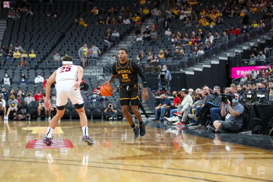 Qua Grant dribbles the ball up the court during the game against Arizona on Nov. 19 inside the T-Mobile Arena.