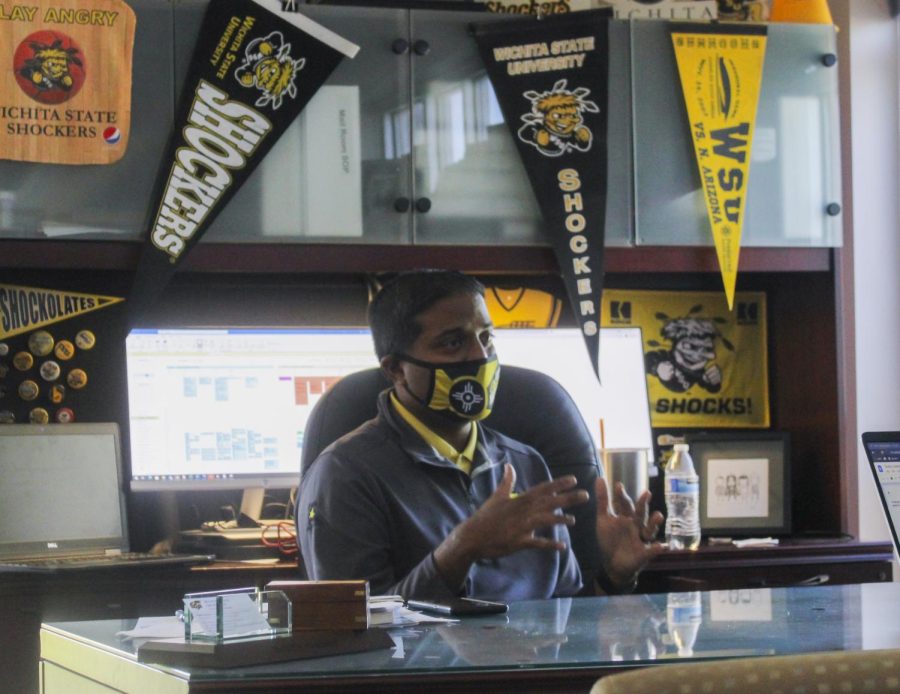 Bobby Gandu, admissions director, in his office decorated with Shocker pride.  He is located in the Marcus Welcome Center, where he got married to his wife Trish who also works at WSU.