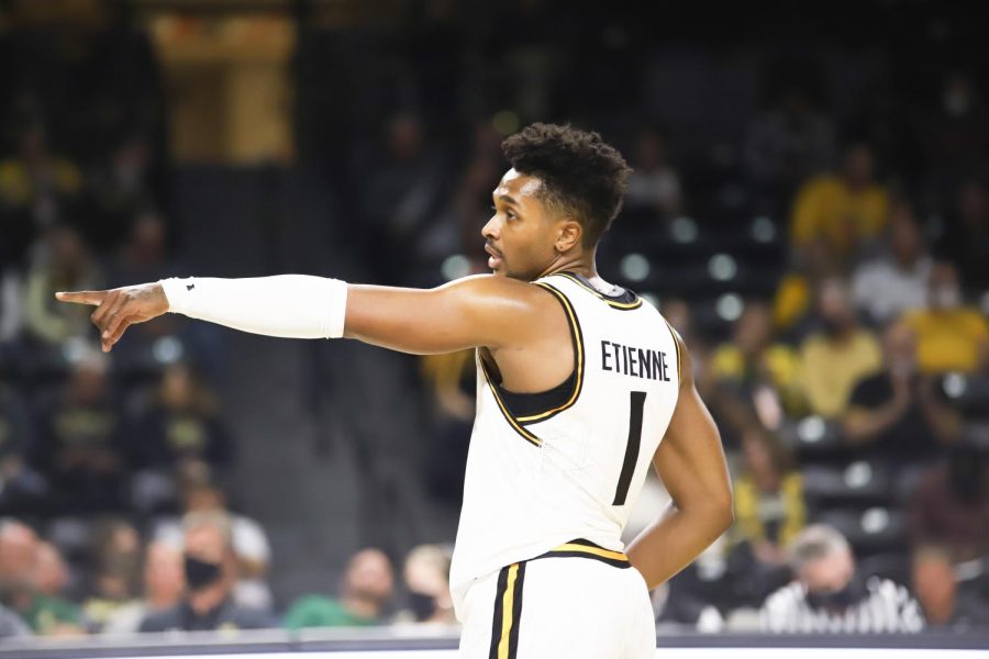 Sophomore Tyson Etienne points toward a teammate during the exhibition game against Missouri Southern State on Nov. 4 inside Charles Koch Arena.