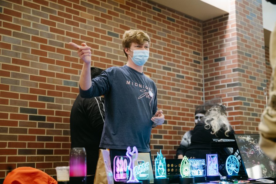 Wichita State student Julian Kincaid talks to a student about his work during Dia de los muertos at WSU. The event was hosted by Office of Diversity and Inclusion in the RSC on Nov 2.