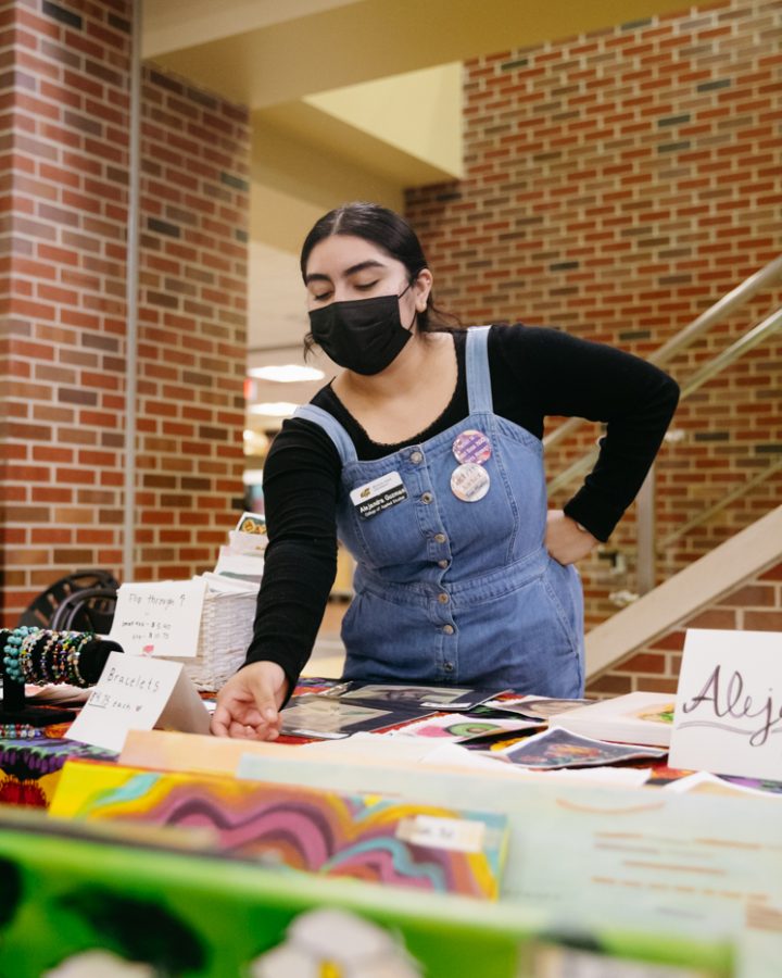Wichita State student Alejandra Guzman talks to a student about her work during Dia de los muertos at WSU. The event was hosted by Office of Diversity and Inclusion in the RSC on Nov 2.