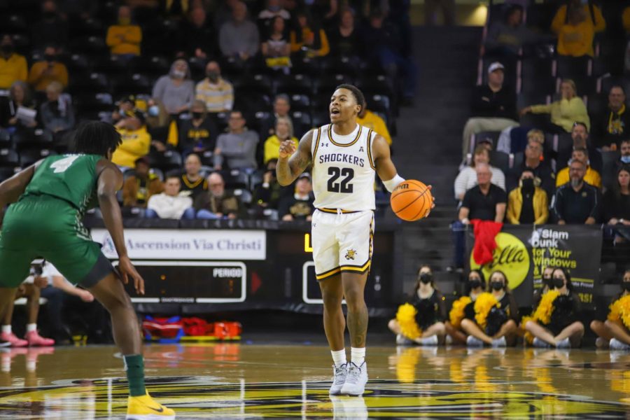 Junior Qua Grant dribbles the ball up the court during the exhibition game against Missouri Southern State on Nov. 1 inside Charles Koch Arena.