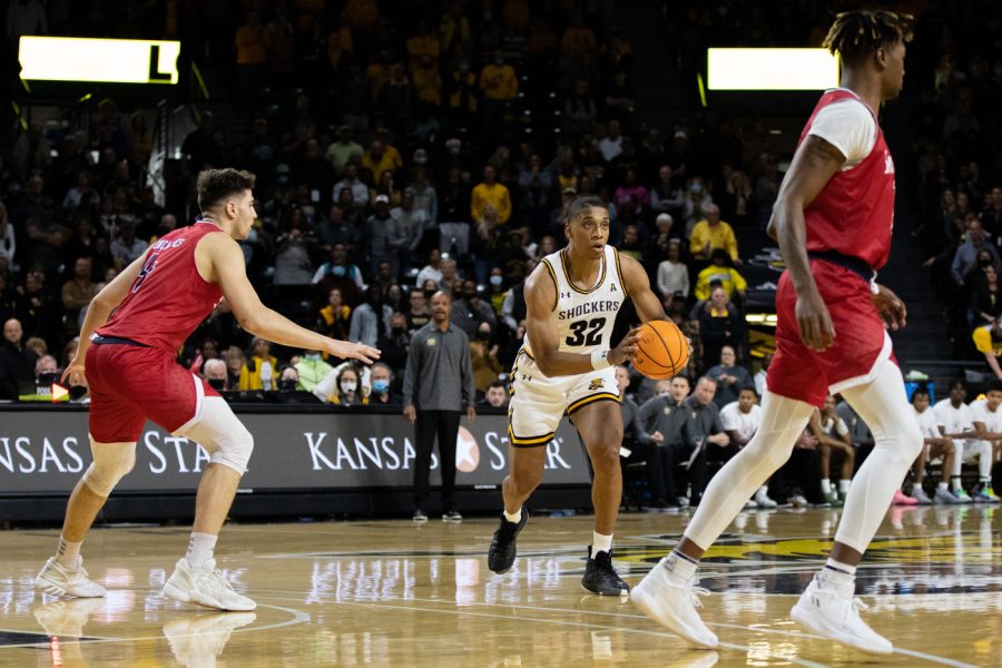 Qua Grant looks for an open player to pass to on 13 Nov. againt South Alabama in the Charles Koch Arena. Grant made a pass to Ricky Council who threw a jump shot.