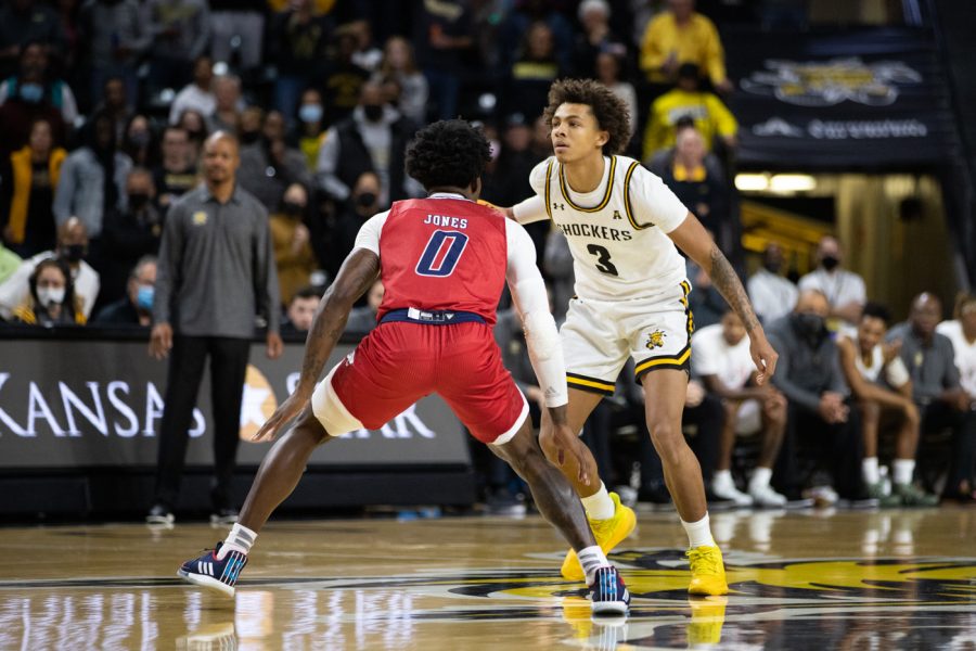 Craig Porter Jr. drives down the court and looks for an open player to pass to. Porter had a successful first half with zero fouls.