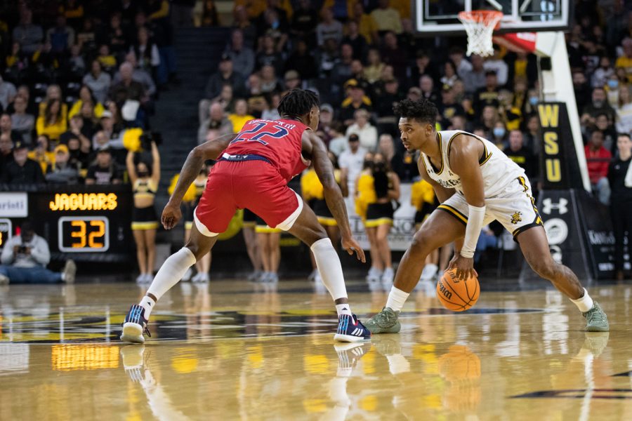 Sophomore Tyson Etienne looks to pass the ball against South Alabama at the Charles Koch Arena on Nov. 13.