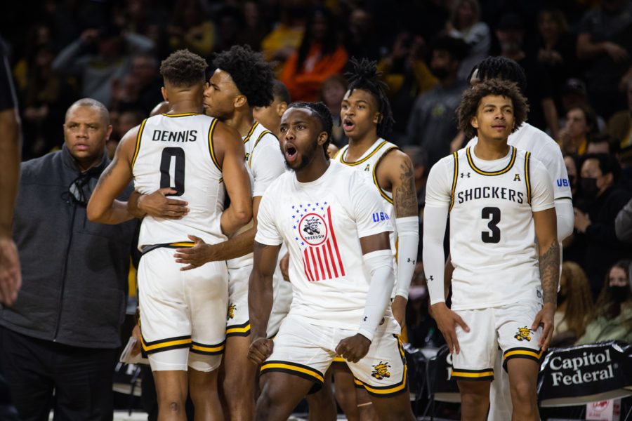 Freshman+Steele+Gaston-Chapman+and+the+rest+of+the+mens+basketball+team+celebrate+after+another+goal+against+South+Alabama.+The+Shockers+emerged+victorious+against+South+Alabama+with+a+score+of+64+-+58.