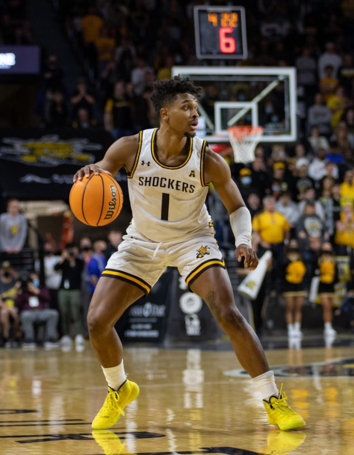 Sophomore Tyson Etienne looks for a teammate to pass the ball to on Nov. 13 in Koch Arena. The Shockers played against South Alabama and won with a score of 64 - 58.