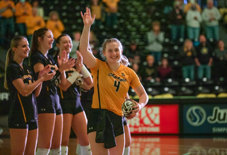 Sophomore Lily Liekweg waves to the crowd before the game against Memphis on Nov. 26.