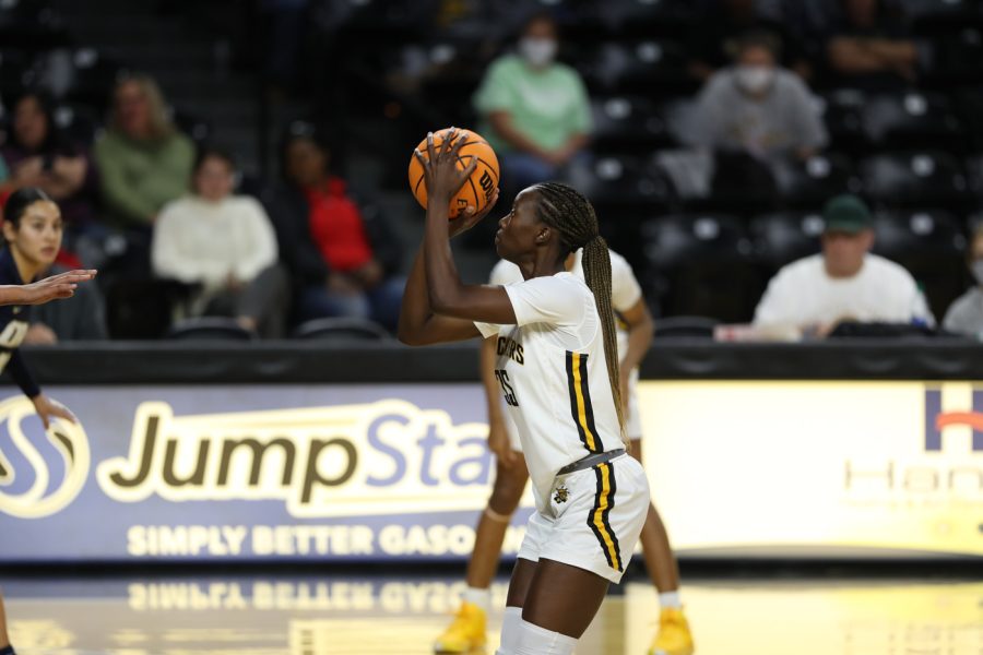 Junior Jane Asinde shoots a free-throw during the game agaisnt ORU on Dec 1 at Charles Koch Arena.