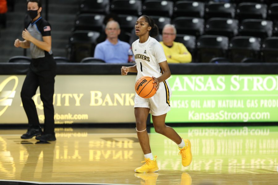 Sophomore DJ McCarty dribbles up the court during the game agaisnt ORU on Dec 1 at Charles Koch Arena.