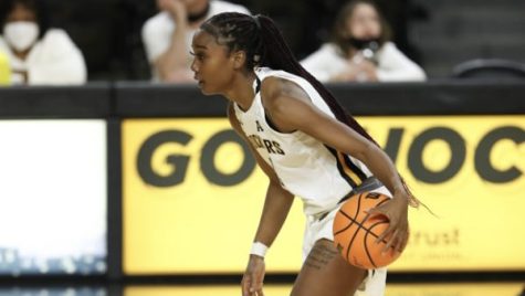 Senior Mariah McCully dribbles up the court during the game agaisnt ORU on Dec 1 at Charles Koch Arena.
