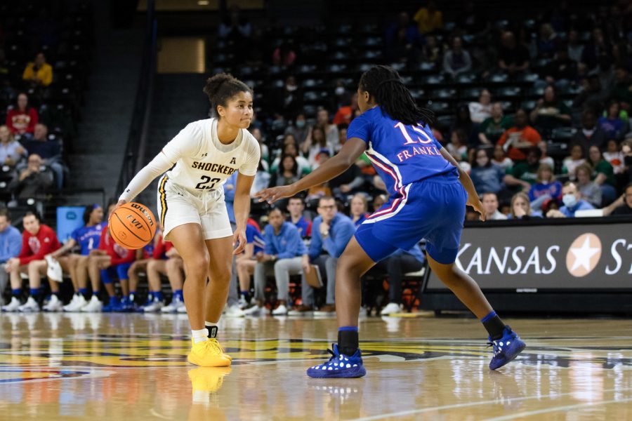 Junior Seraphine Bastin dribbling the ball during the game against KU at Charles Koch Arena on Dec. 21.