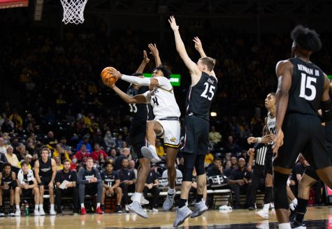 Freshman Ricky Council IV drives through Cincinnati opposition to shoot the ball on Jan. 16 in Koch Arena.