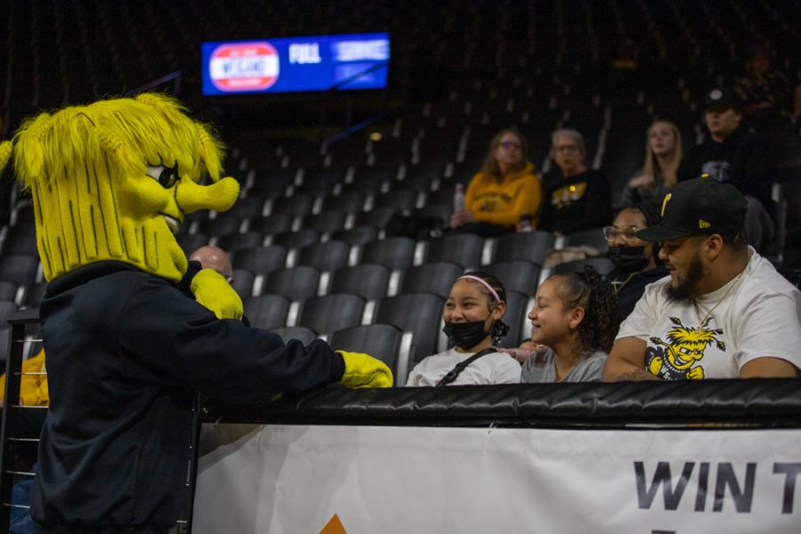 Wu talks to excited fans  during the game against Houston at Charles Koch Arena on Jan. 5.