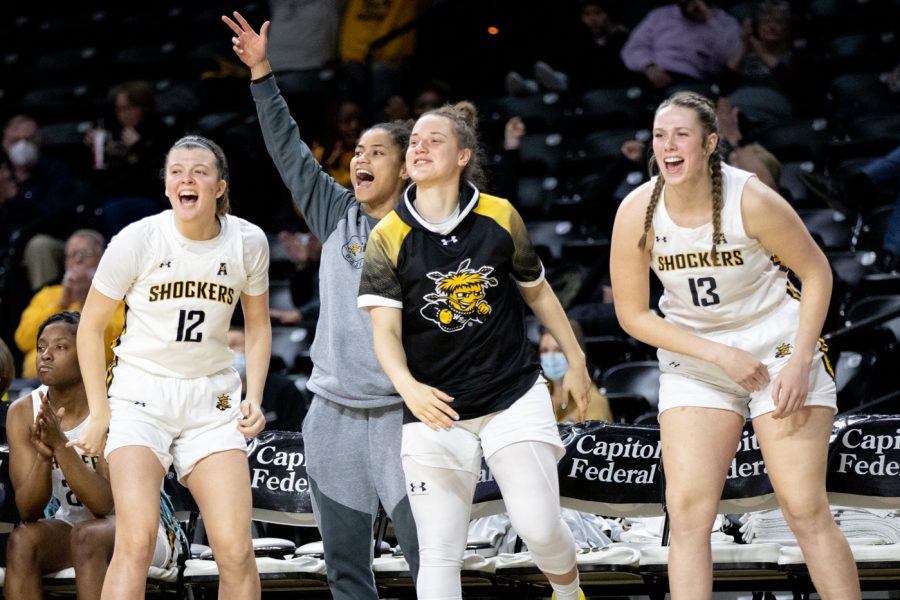 The+womens+basketball+team+cheer+for+their+teammates+as+they+run+down+the+clock+against+East+Carolina.+The+Shockers+are+currently+2-2+in+their+conference+season.