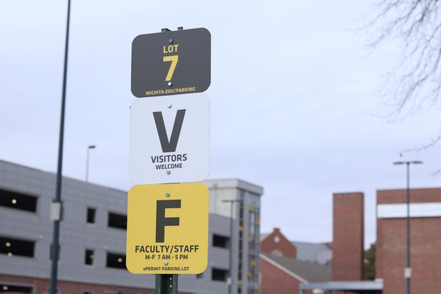 These signs are in the Rhatigan Student Center parking lot. The sign is to inform vistors and faculty that parking is available to them in this lot.