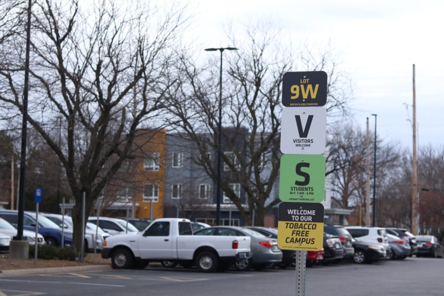 These signs are across the street from Elliot Hall. The sign is to inform vistors and students that parking is available to them in this lot.