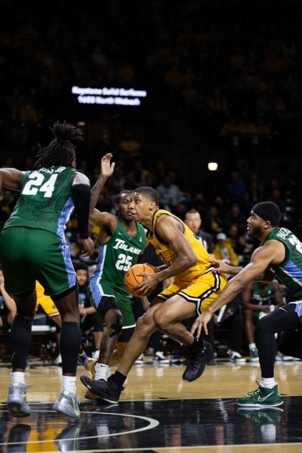 Junior Joe Pleasant drives the ball before going in for a lay-up on Tulane on Jan. 12. Wichita State narrowly lost 68-67.