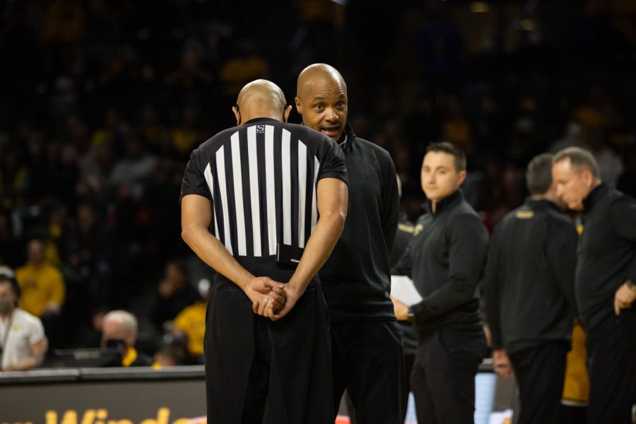 Head coach Isaac Brown speaks to a referee after a few controversial plays and calls during the game against Tulane on Jan. 12.