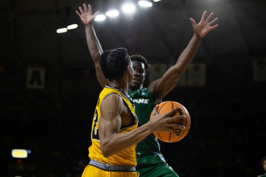 Freshman Chaunce Jenkins looks for a teammate to pass the ball to during the game against Tulane on Jan. 12. Tulane narrowly claimed victory, 68-67.