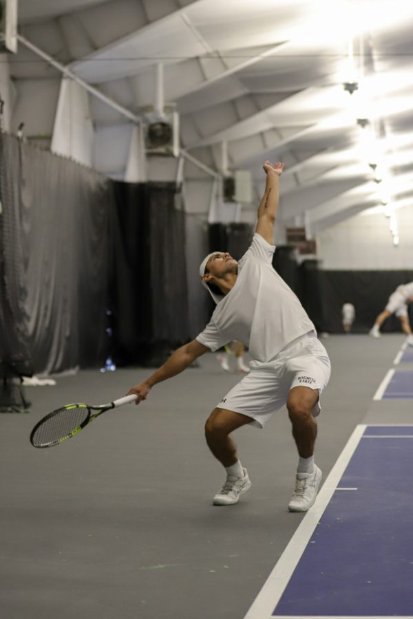 Junior Nicolas Acevedo serves the ball on Jan. 23 at the Genesis Health Clubs. Acevedo finished 2-1 in the singles competition against Athell Bennett.