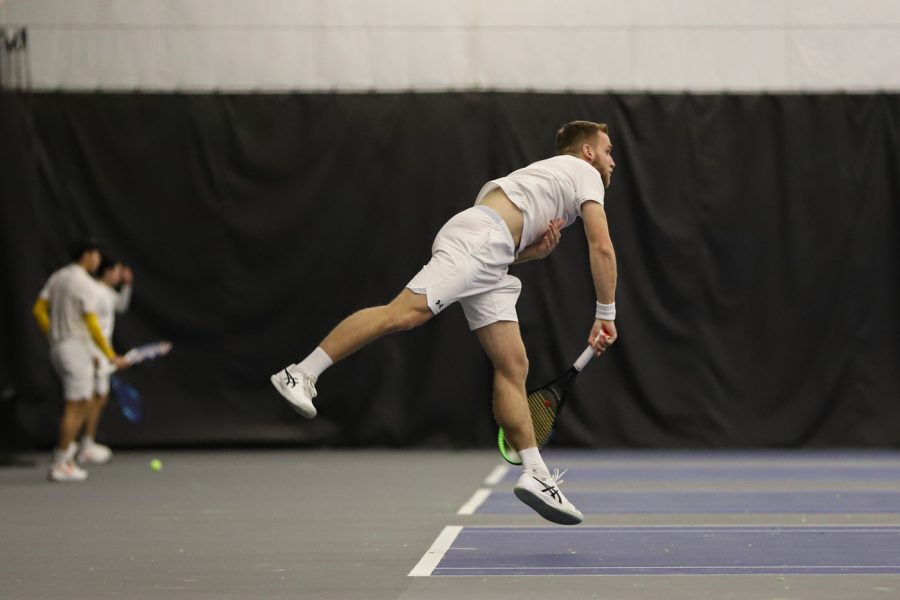 Junior Orel Ovil backhands the ball during his match against Purdue on Jan. 23. Ovil won his singles match against Milledge Cossu 2-0.