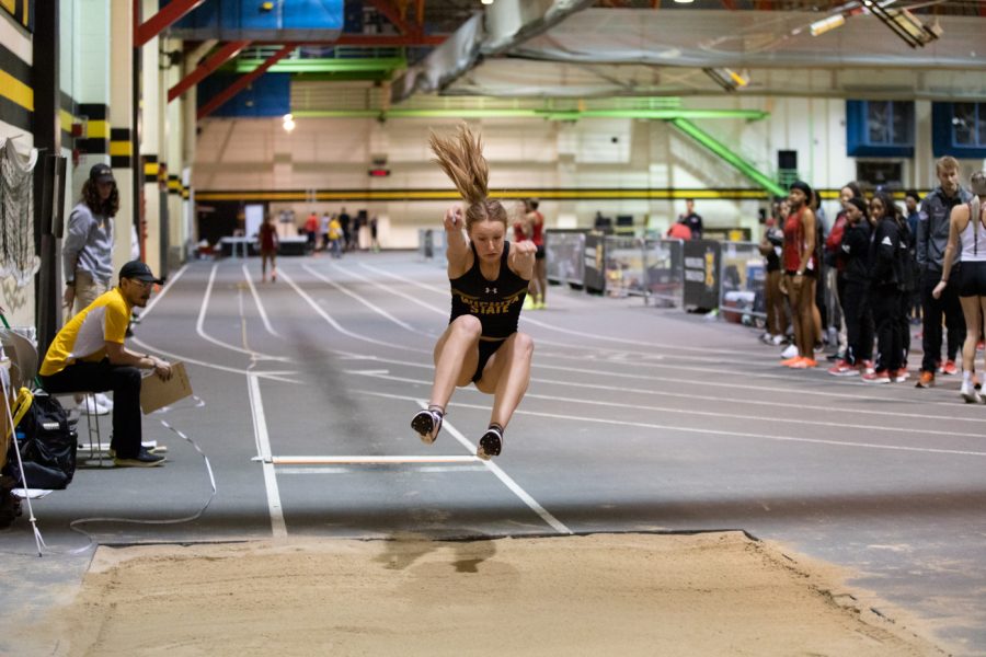 Freshman Grace Lange leaps during the long jump event during the track and field meet on Jan. 13.