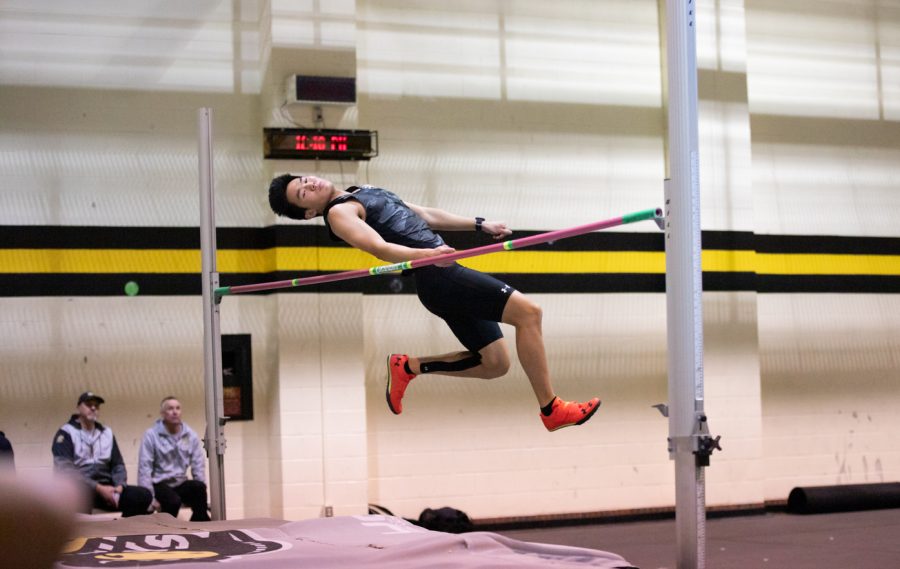 An athlete performs in the high jump during the track and field event on Jan. 13.